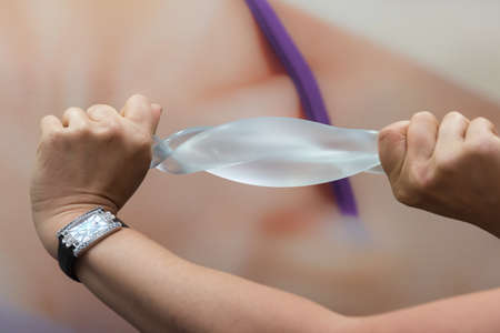 test for the strength and elasticity of a silicone breast implantの写真素材