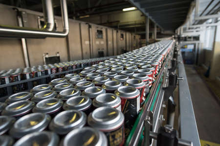 St. Petersburg, Russia - March 1, 2016: The production line of the brewing company. Automatic conveyor plant. Spilling beer in aluminum jarsのeditorial素材