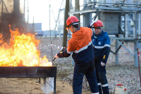 St. Petersburg, Russia - October 17, 2017: Employees of the energy company at training sessions on fire fighting.のeditorial素材