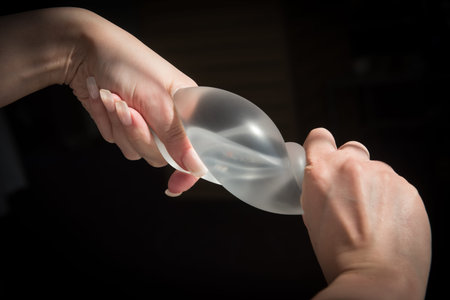 Demonstration of the properties of elasticity, softness, strength, reliability of silicone breast...