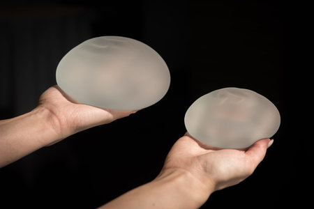 Demonstration of the properties of elasticity, softness, strength, reliability of silicone breast...