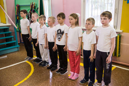 Leningrad region, Russia - May 12, 2017: Schoolchildren of the junior class of rural schools stand in the ranks in physical education classes.のeditorial素材