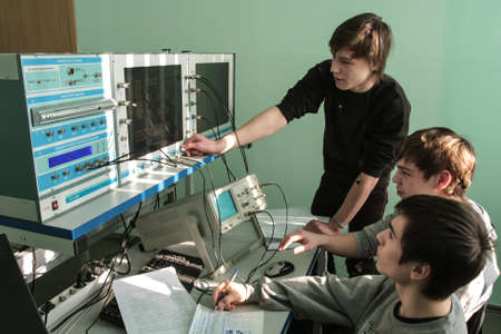 St. Petersburg, Russia - February 16, 2012: Students of Electrotechnical College during laboratory tests with an ascendant and desktop monitors.のeditorial素材