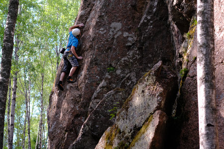 Leningrad region, Russia - June 23, 2018: Climbers during training sessions on overcoming rocky...