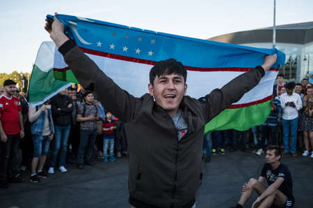 St. Petersburg, Russia - June 26, 2018: Fans in the fan zone in front of the stadium Zenit Arena during the World Cup soccer match Nigeria - Mexico are cheering for their teams.のeditorial素材