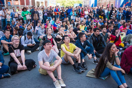 St. Petersburg, Russia - June 27, 2018: Fans watch a football match between Germany and Korea in the fan zone in the city center on the big screen, express their emotions.のeditorial素材