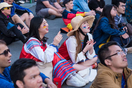St. Petersburg, Russia - June 27, 2018: Fans watch a football match between Germany and Korea in the fan zone in the city center on the big screen, express their emotions.のeditorial素材