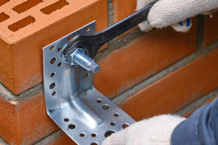 Red hollow brick. Brickwork. Installation of a chemical anchor using a special tool - resin, sleeve...