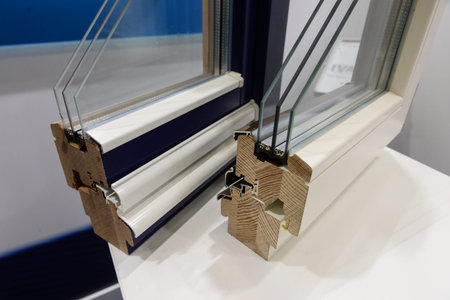 demonstration of elements of a two-chamber plastic and wooden window to the consumer. Sample showing...