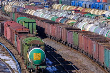 St. Petersburg, Russia - March 27, 2019: Top view of the sorting railway station for freight transport. Freight cars during sorting. Industrial transport of various goods.のeditorial素材