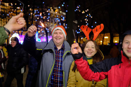 St. Petersburg, Russia - January 1, 2019: Young people on New Year's Eve burn out sparklers on the Palace Square of the city during mass festivities.のeditorial素材