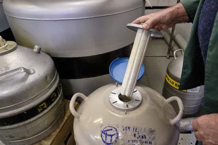 St. Petersburg, Russia - April 23, 2019: Checking the tank with liquid nitrogen in tanks for storage...