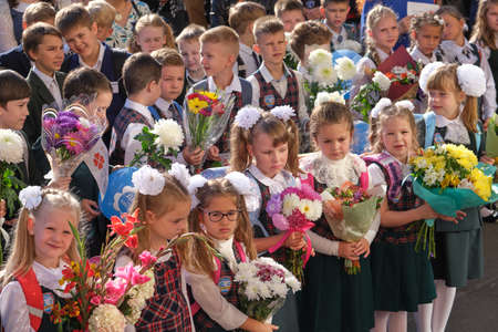 St. Petersburg, Russia - September 2, 2019: Solemn meeting of schoolchildren before the start of the school year. Clear sunny day. Beautiful lighting. Beautiful elegant childrenのeditorial素材