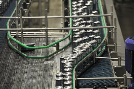 Tula, Russia - September 19, 2017: Production line, conveyor, aluminum cans with finished beer on a...