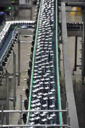 Tula, Russia - September 19, 2017: Production line, conveyor, aluminum cans with finished beer on a conveyor belt. Brewery inside. Modern production technologyのeditorial素材