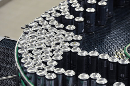 Tula, Russia - September 19, 2017: Production line, conveyor, aluminum cans with finished beer on a...
