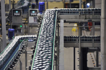 Tula, Russia - September 19, 2017: Production line, conveyor, aluminum cans with finished beer on a conveyor belt. Brewery inside. Modern production technologyのeditorial素材