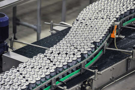 Tula, Russia - September 19, 2017: Production line, conveyor, aluminum cans with finished beer on a conveyor belt. Brewery inside. Modern production technologyのeditorial素材