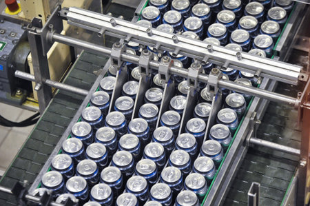 Tula, Russia - September 19, 2017: Production line, conveyor, aluminum cans with finished beer on a...