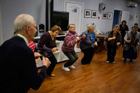 St. Petersburg, Russia - September 26, 2018: social municipal house for elderly people daytime stay. Entertaining event. Dance, round danceのeditorial素材
