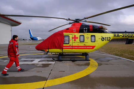 St. Petersburg, Russia - March 11, 2020: Helicopter of the national air ambulance service on the take-off platform in preparation for the departureのeditorial素材