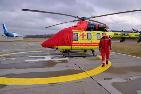 St. Petersburg, Russia - March 11, 2020: Helicopter of the national air ambulance service on the take-off platform in preparation for the departureのeditorial素材