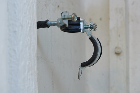 The clamp is plumbing, with a rubber gasket installed in a real situation. Screws, bolt, steel,...