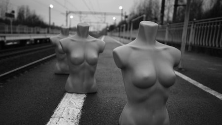 Bodysuit of a plastic mannequin on a railway platform as a symbol of anxiety, feelings of dejection,...