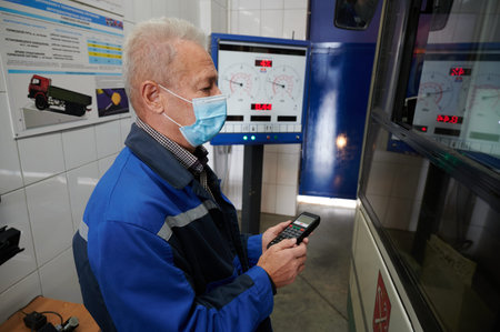 A motorist conducts diagnostics of the vehicles brake system at the MAHA booth.