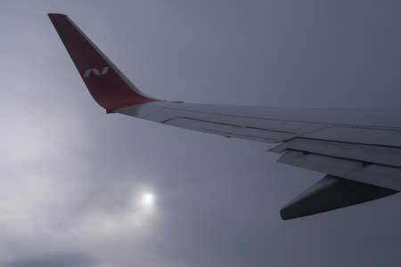 nordwind airplane wing with the emblem of the airline company against the skyのeditorial素材