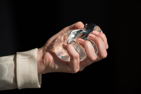 Silicone implant of the female breast during the demonstration of its quality.