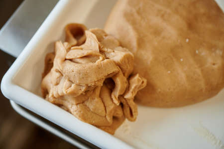 Gingerbread dough close-up on the desktop of a confectioner in the process of preparing confectioneryの写真素材