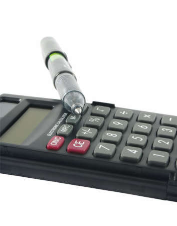 Calculator and pen isolated on whiteの写真素材