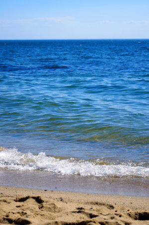 Beautiful piece of ocean with beachの写真素材