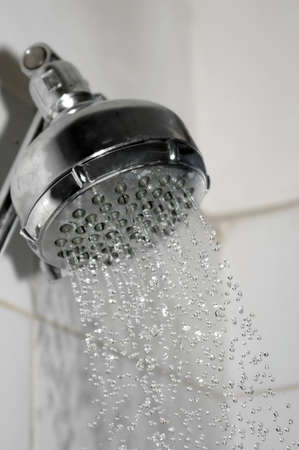 Close up of working shower at bathroomの写真素材