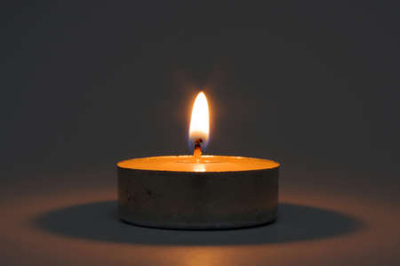Close up of memorial candle in the darknessの写真素材