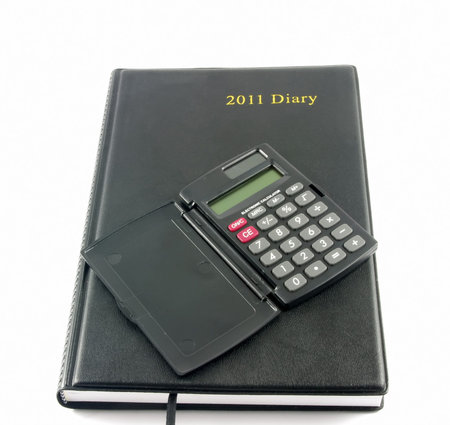 Diary and calculator on white background