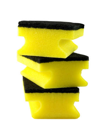 three yellow cleaning sponges over whiteの写真素材