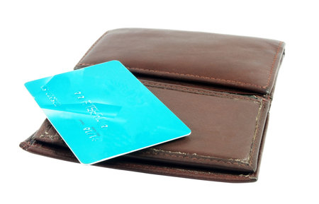 Wallet with credit card isolated on white surface