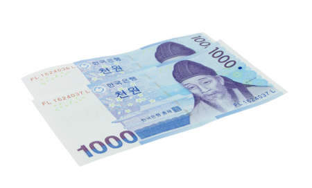two korean won money notes over whiteの写真素材