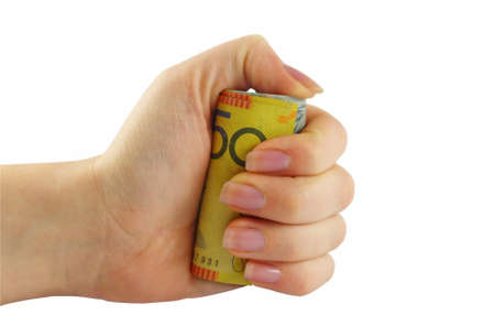 female hand holding australian money in fistの写真素材