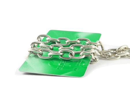 credit card locked in the chain over whiteの写真素材