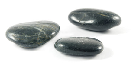 three spa black stones closeup