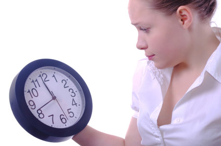 young businesswoman looking at the clock