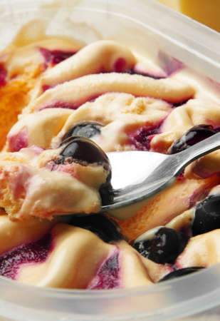  ice cream with berries and spoonの写真素材