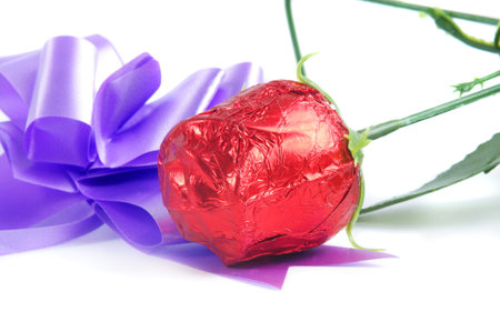 sweet gift as a paper rose with ribbonの写真素材