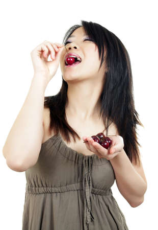 portrait of beautiful fashion asian woman with cherryの写真素材