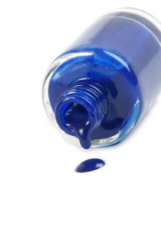 blue nail polish bottle on whiteの写真素材