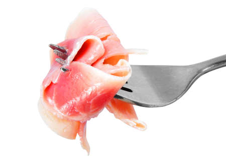 piece of bacon on old forkの写真素材