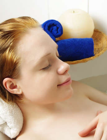 beautiful girl relaxing in the bathの写真素材